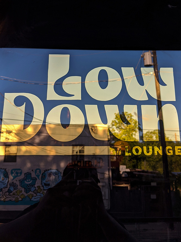 low down lounge window sign austin tx